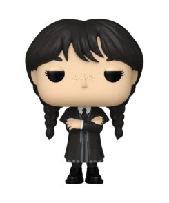 Figurine Funko Pop Mercredi Addams n° 1815, manteau noir, tresses et bras croisés.